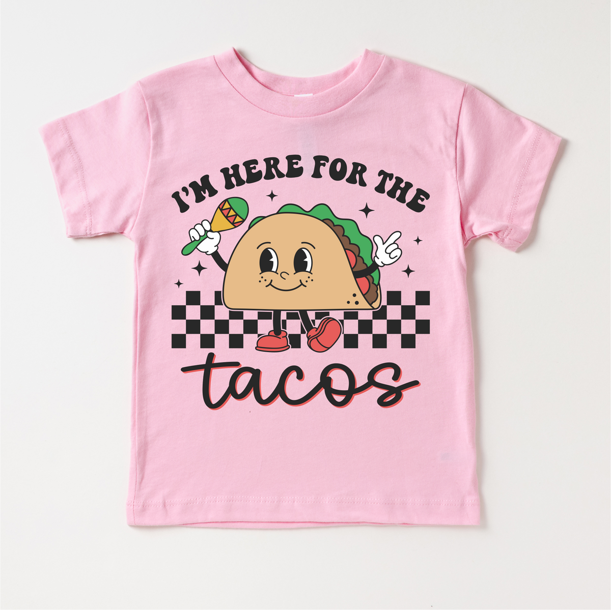 I'm Here For The Tacos Cinco De Mayo design on a pink garment.