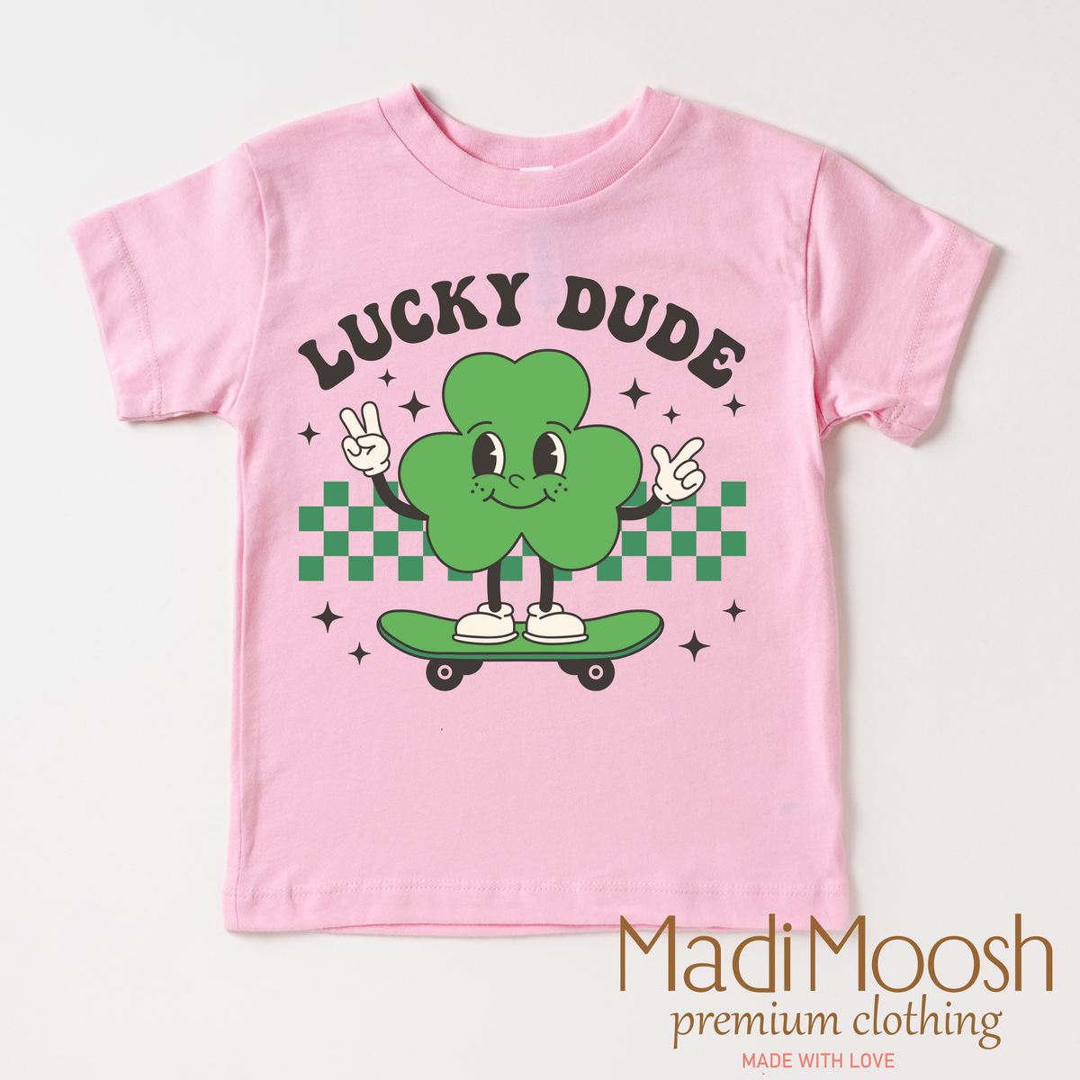 Lucky Dude St. Patrick's Day design on a pink garment.