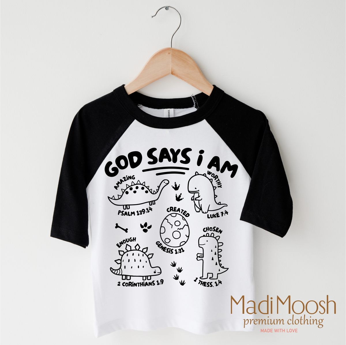 God Says I Am Dinosaur design on a black-accented shirt.