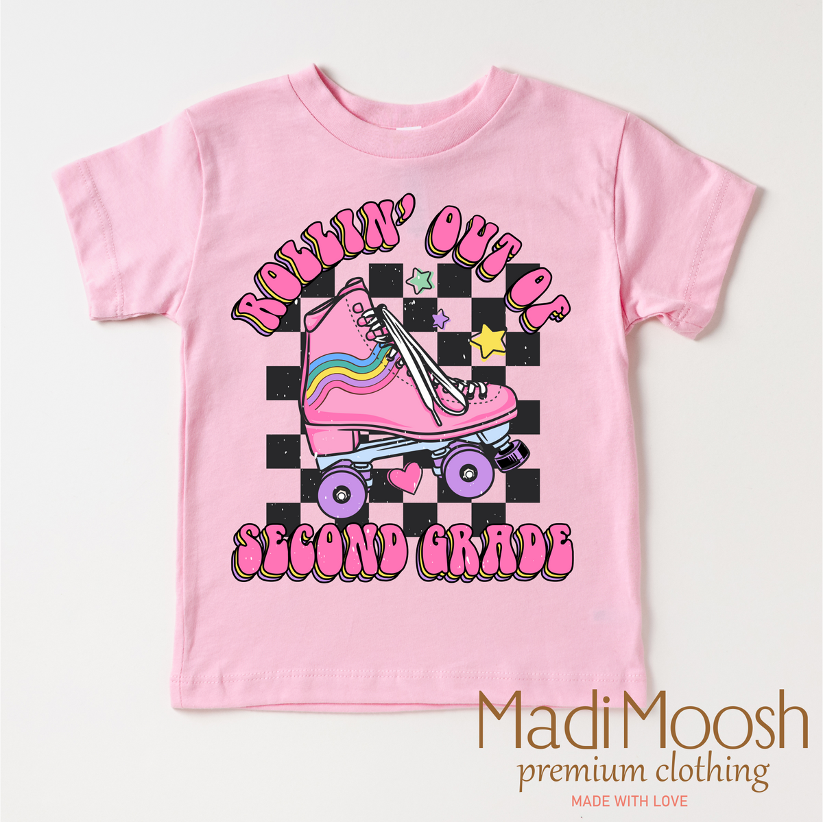 Rollin' Out Of 2nd Grade Last Day Of School design on a pink garment.