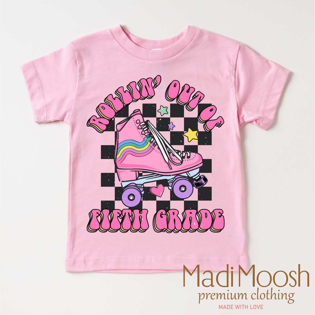 Rollin' Out Of 5th Grade Last Day Of School design on a pink garment.