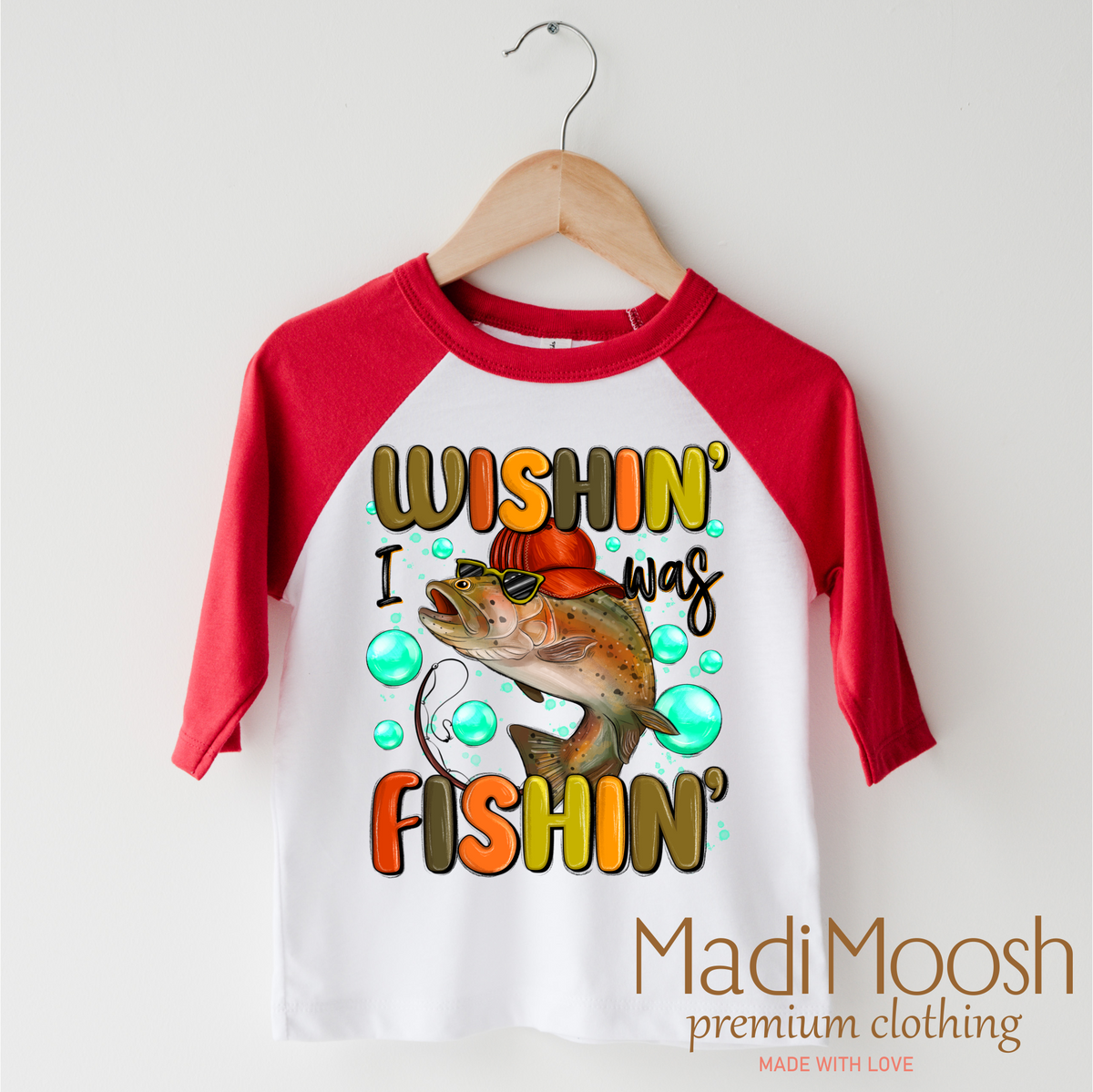 Wishing I Was Fishing design on a red-accented shirt.
