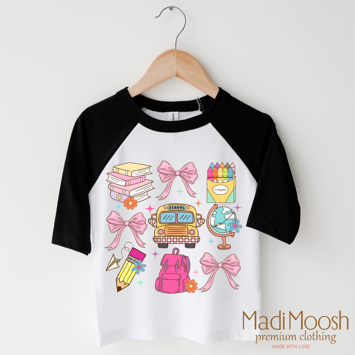 Cute Girls School design on a black-accented shirt.