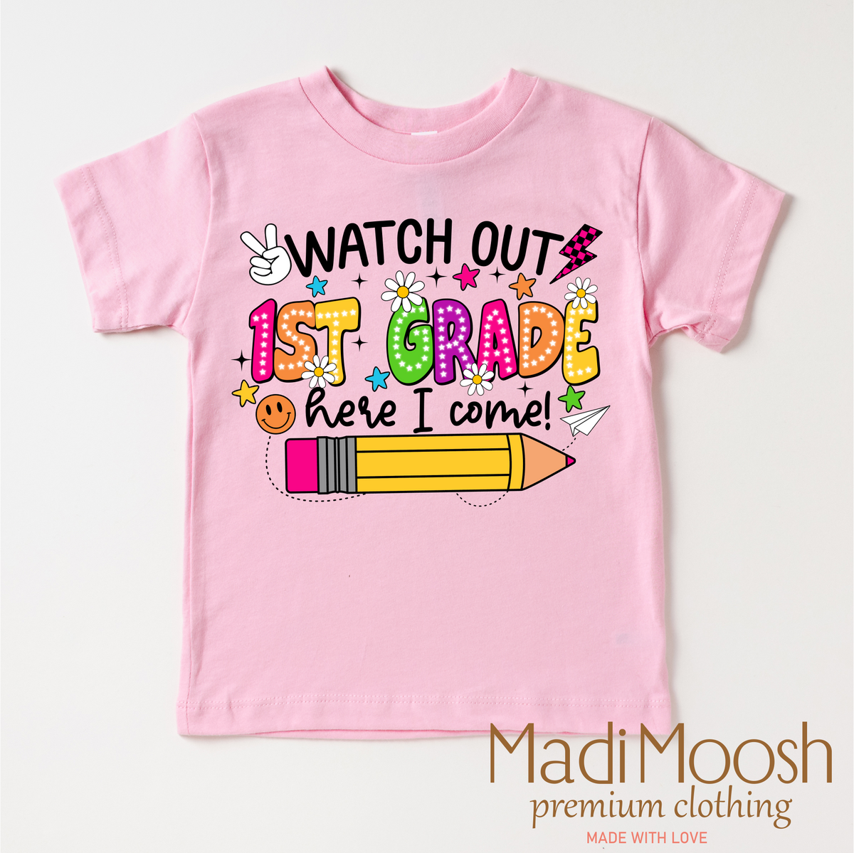 Watch Out 1st Grade Here I Come design on a pink garment.
