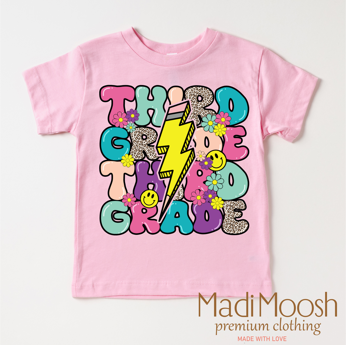 Third Grade Lightning Bolt Back To School design on a pink garment.