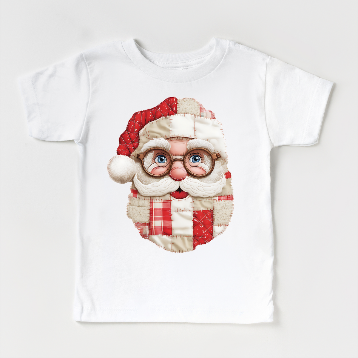 Faux Santa Patchwork Christmas design on a white garment.