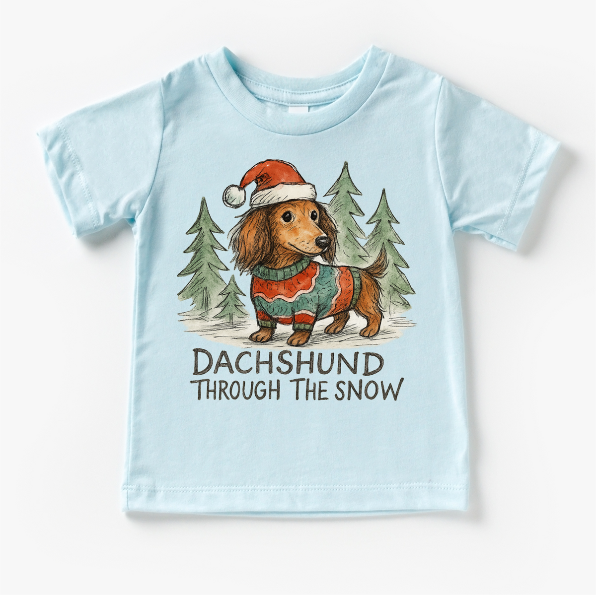 Dachshund Through The Snow Christmas design on a blue garment.