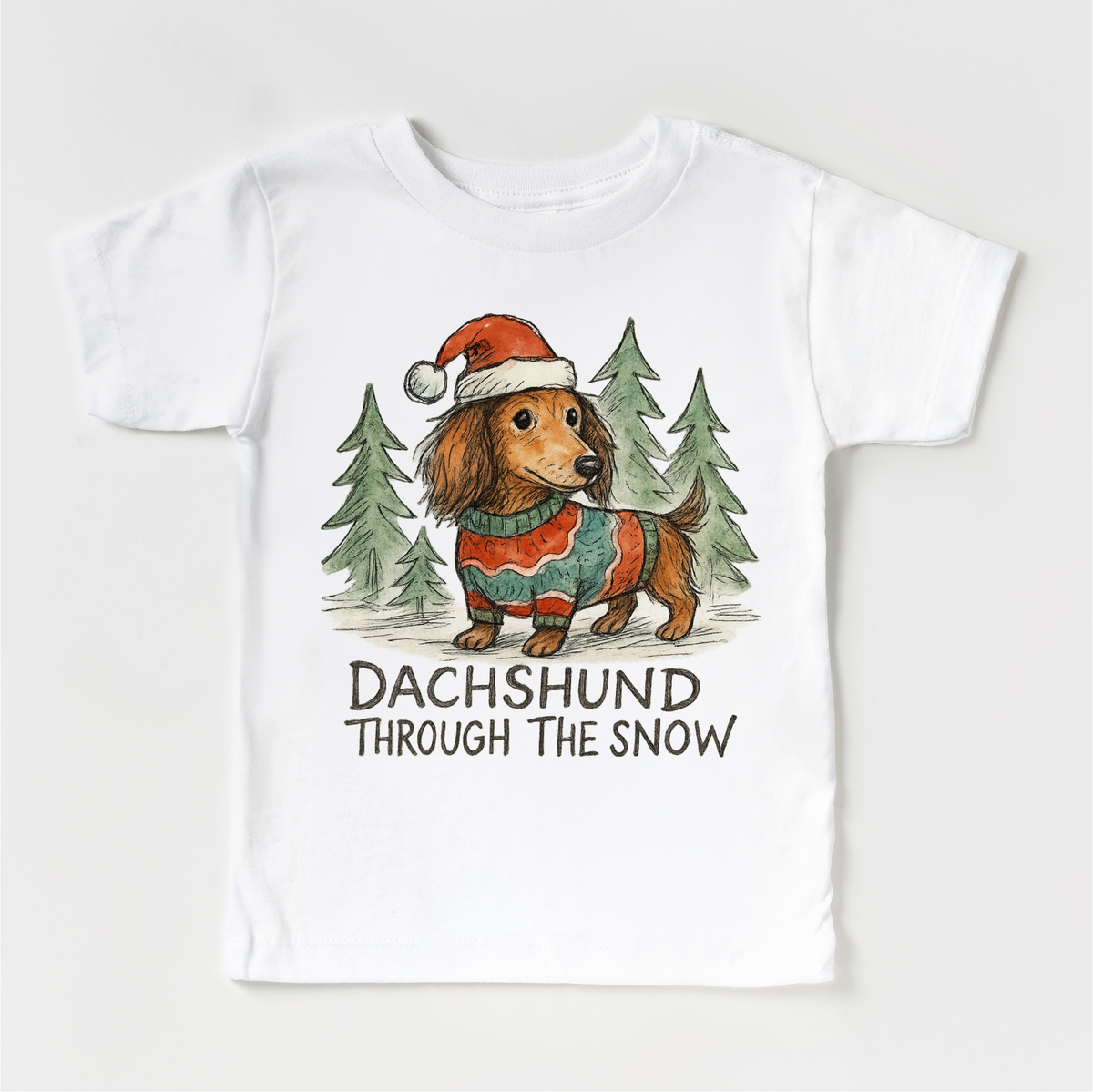 Dachshund Through The Snow Christmas design on a white garment.
