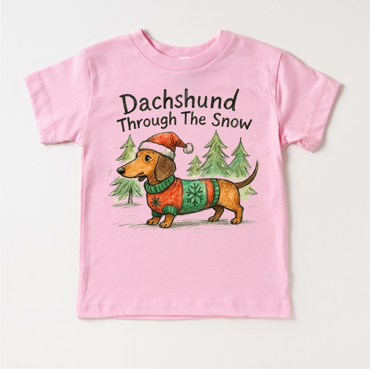 Dachshund Through The Snow Christmas design on a pink garment.