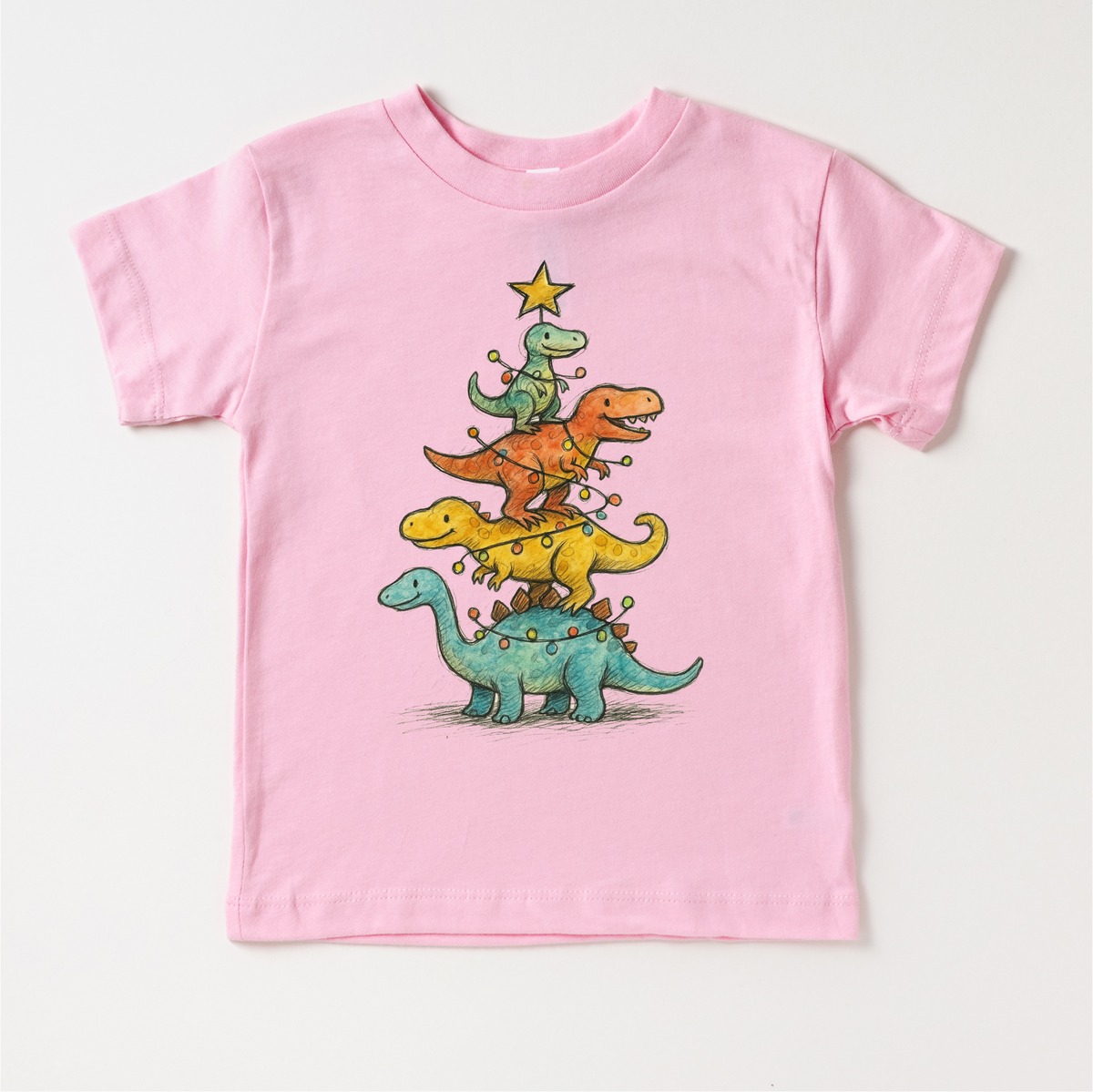 Dinosaur T-Rex Christmas Tree design on a pink garment.