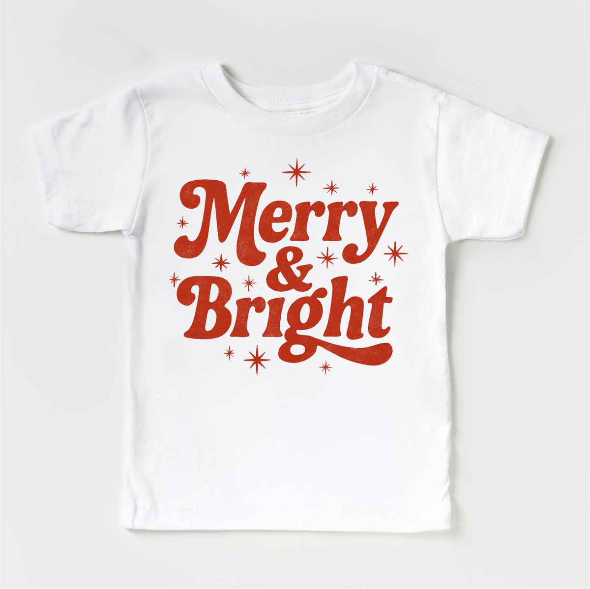 Merry And Bright Christmas design on a white garment.