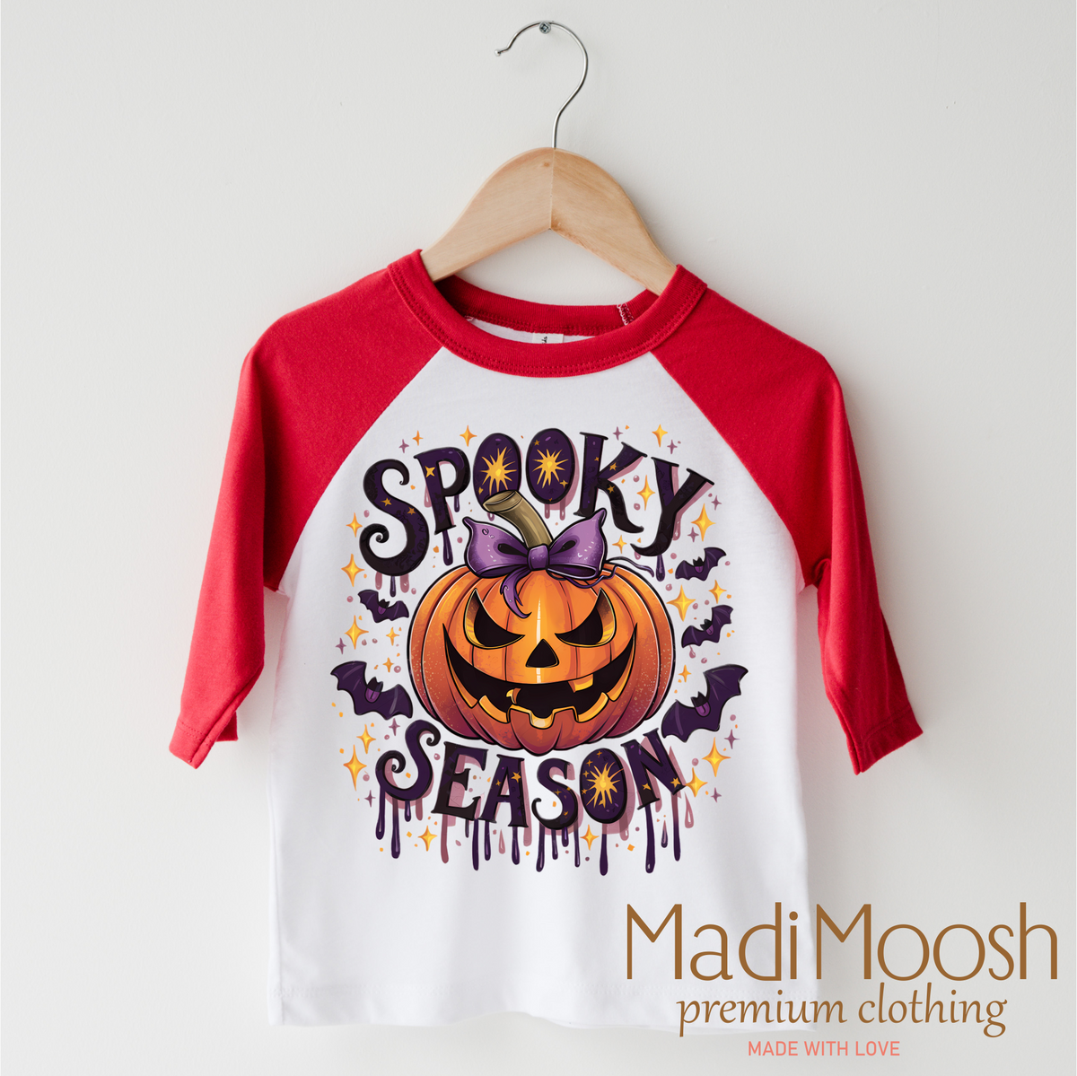 Spooky Season Pumpkin design on a red-accented shirt.