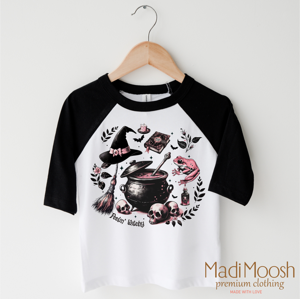 Feeling Witchy Halloween design on a black-accented shirt.