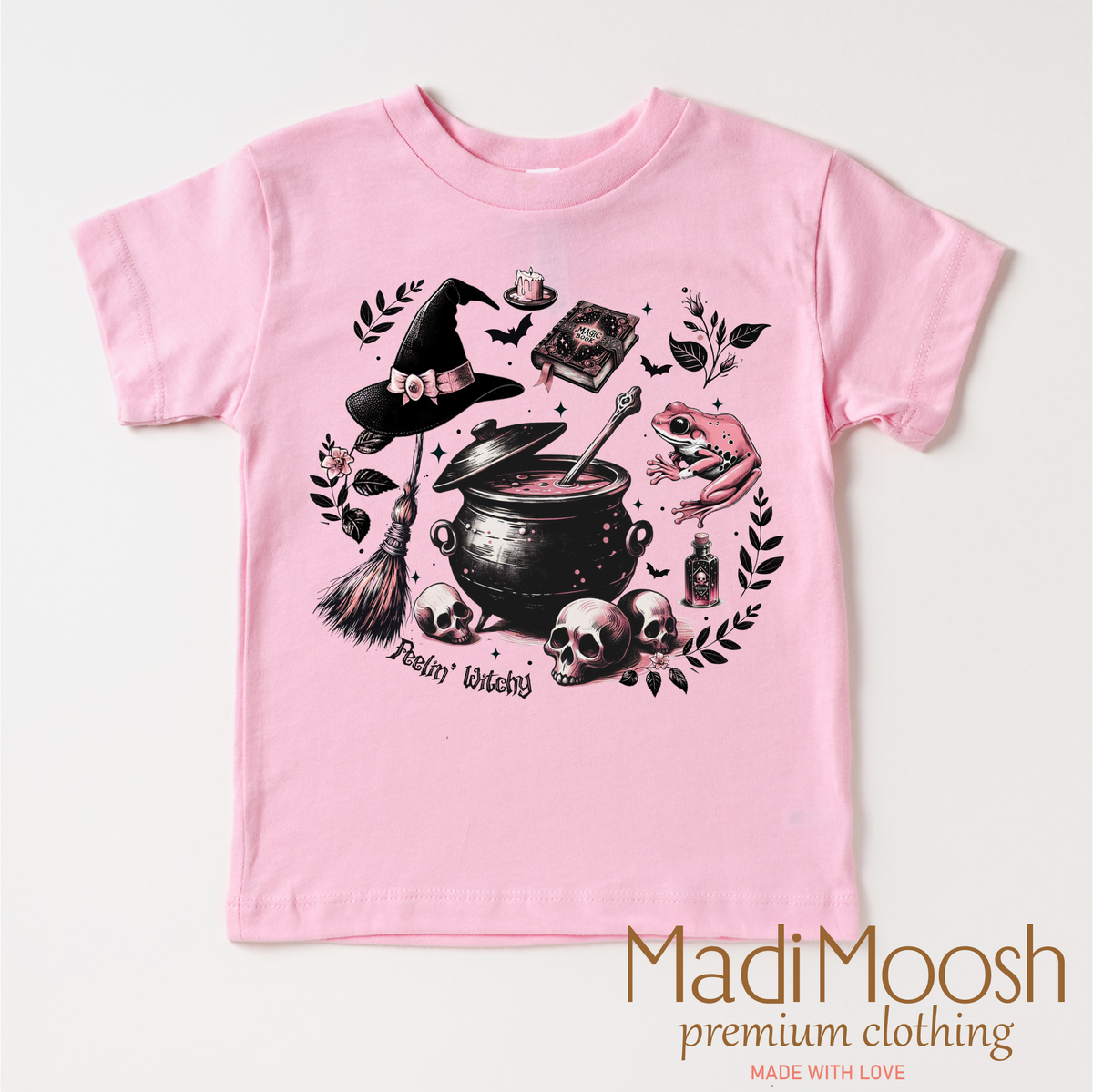 Feeling Witchy Halloween design on a pink garment.