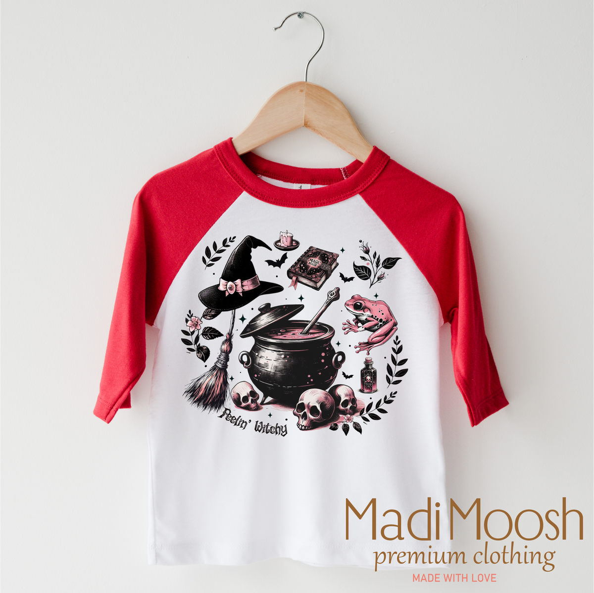 Feeling Witchy Halloween design on a red-accented shirt.