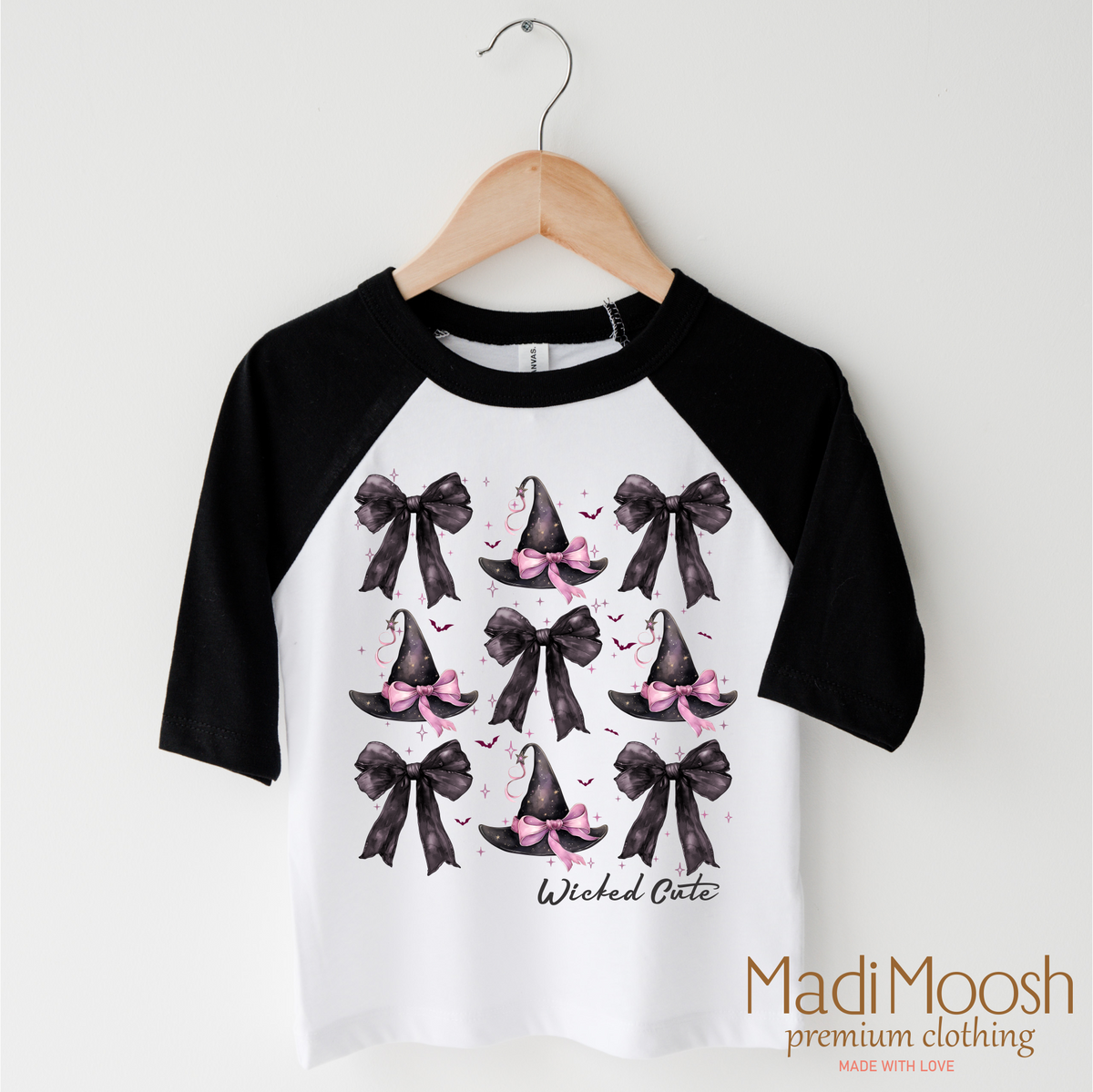 Witch Hats And Bows Halloween design on a black-accented shirt.