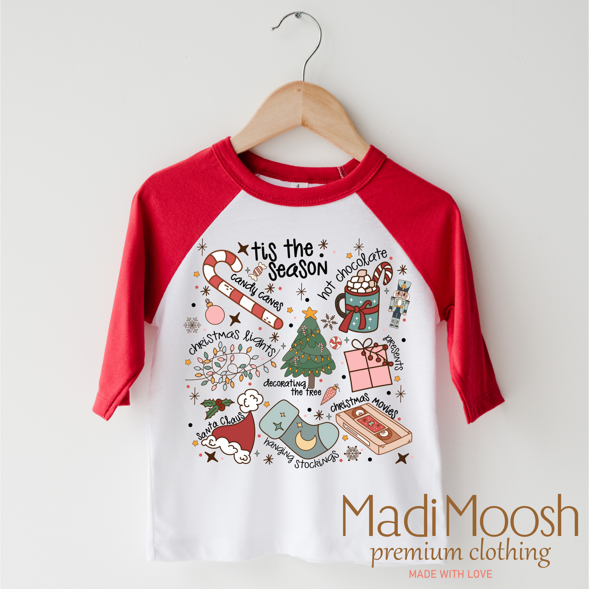Tis The Season Christmas design on a red-accented shirt.