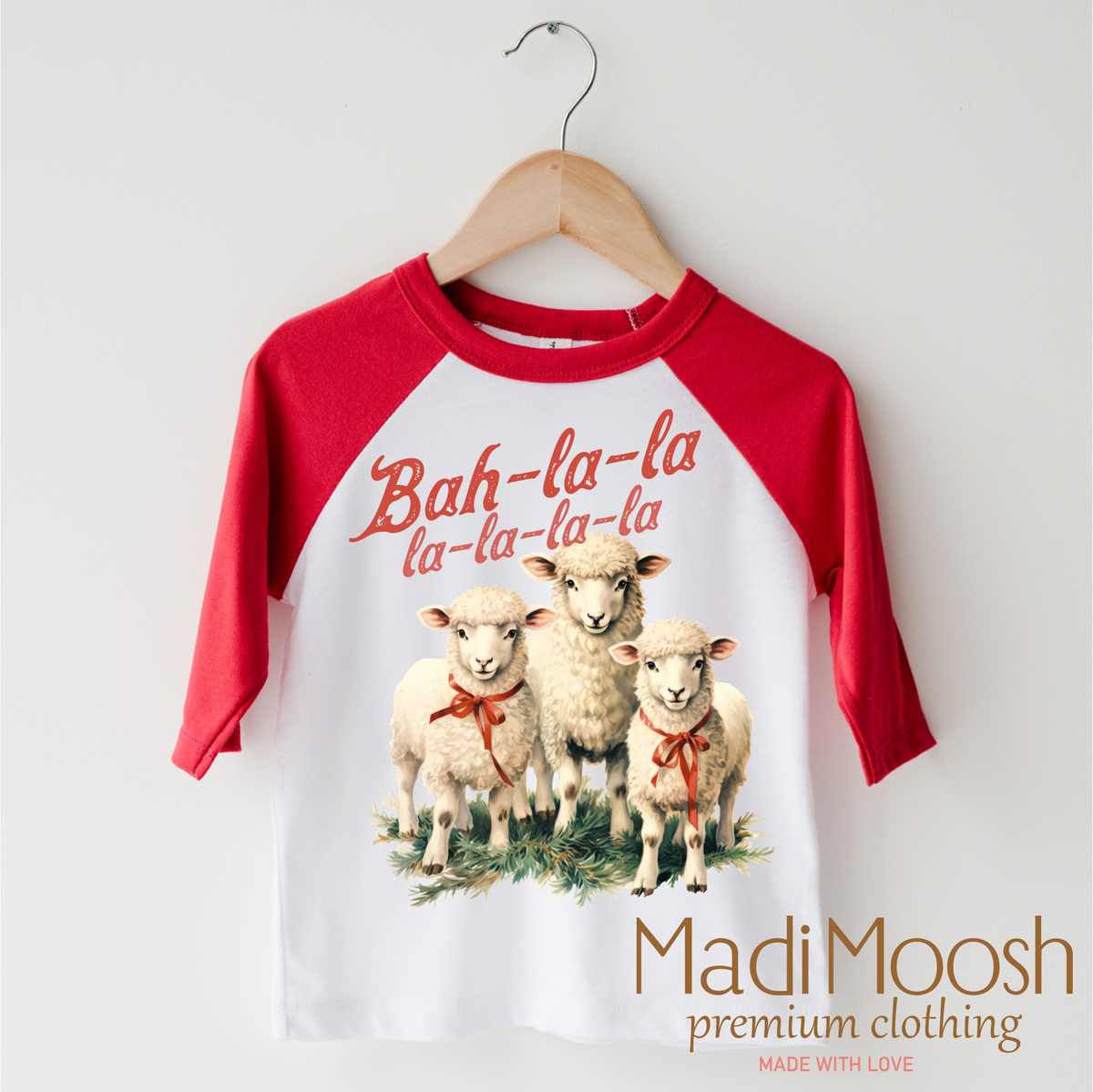 Bah-La-La-La Lamb Christmas design on a red-accented shirt.