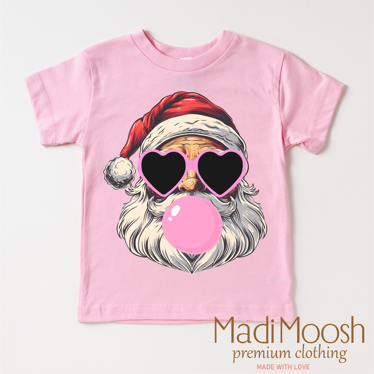 Santa Claus Blowing Bubbles Christmas design on a pink garment.