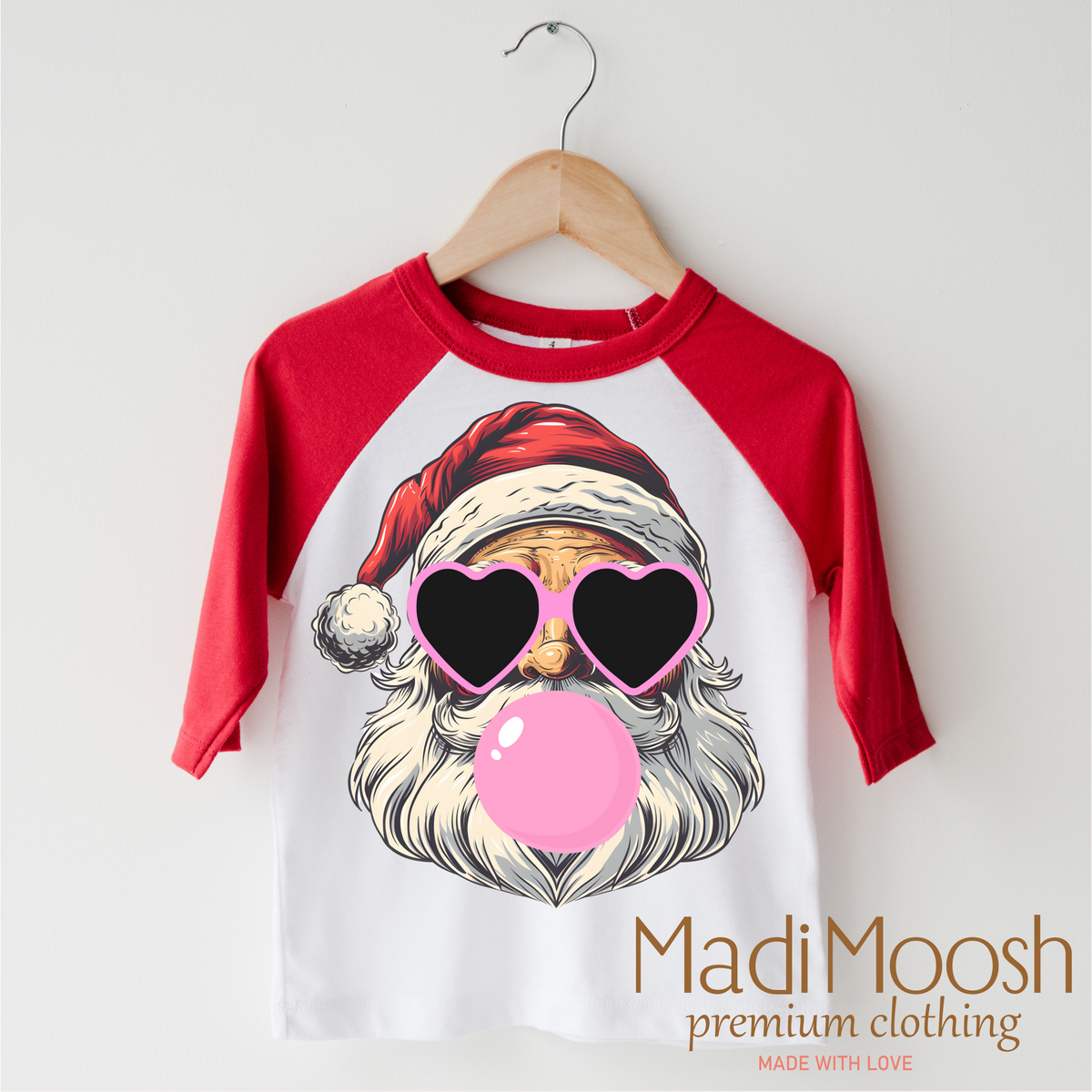 Santa Claus Blowing Bubbles Christmas design on a red-accented shirt.