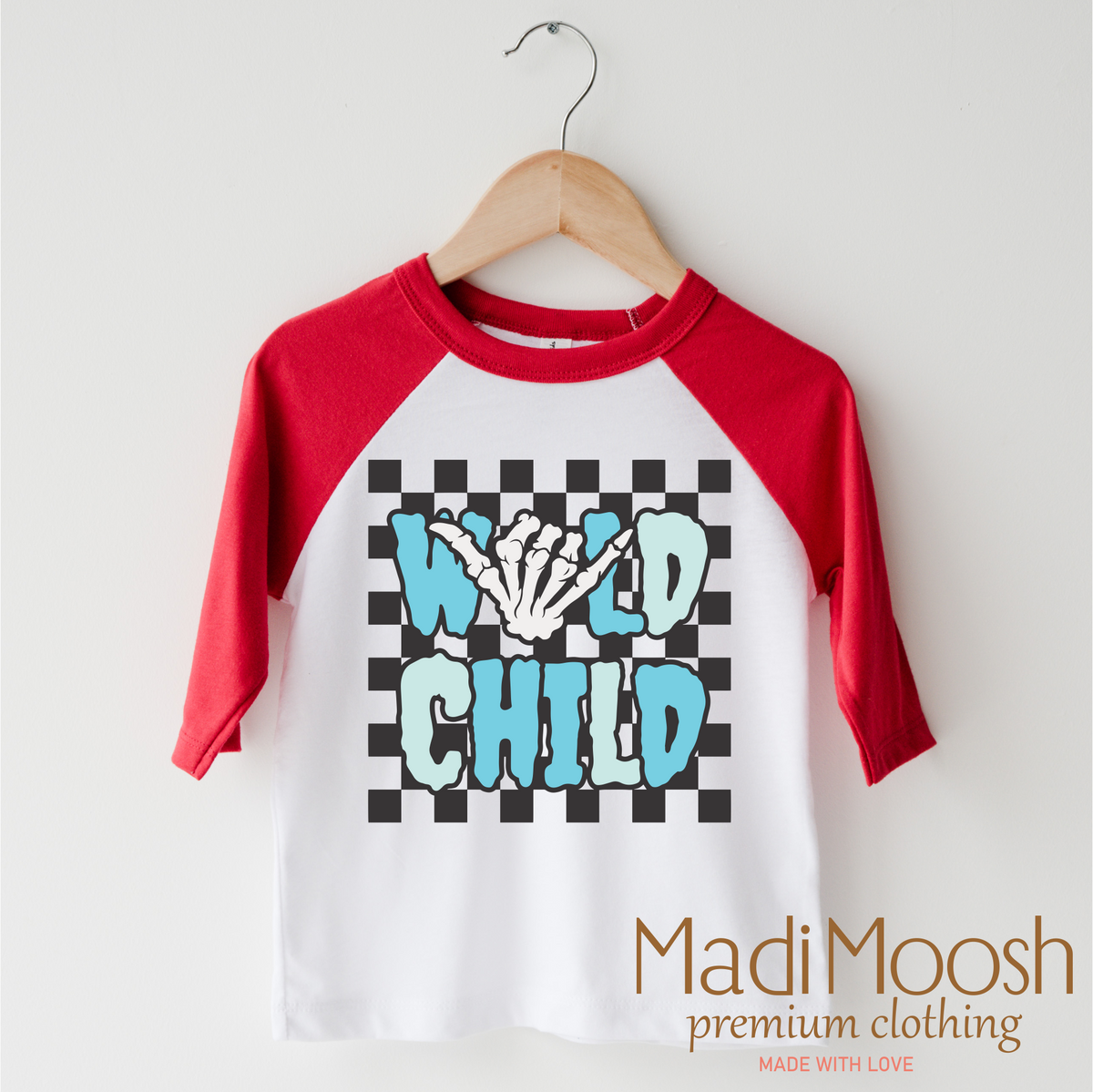 Wild Child Halloween design on a red-accented shirt.