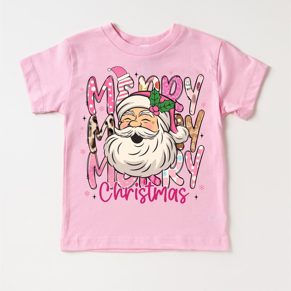 Girls Merry Merry Christmas Santa design on a pink garment.