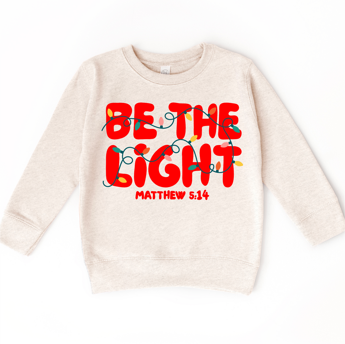 Be The Light Christmas Shirt product design and garment details.