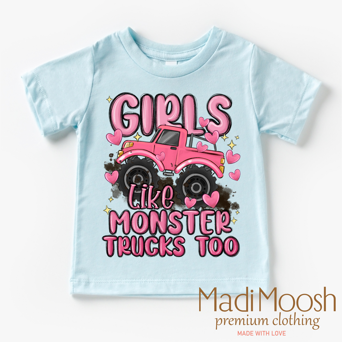 Girls Like Monster Trucks Too design on a blue garment.