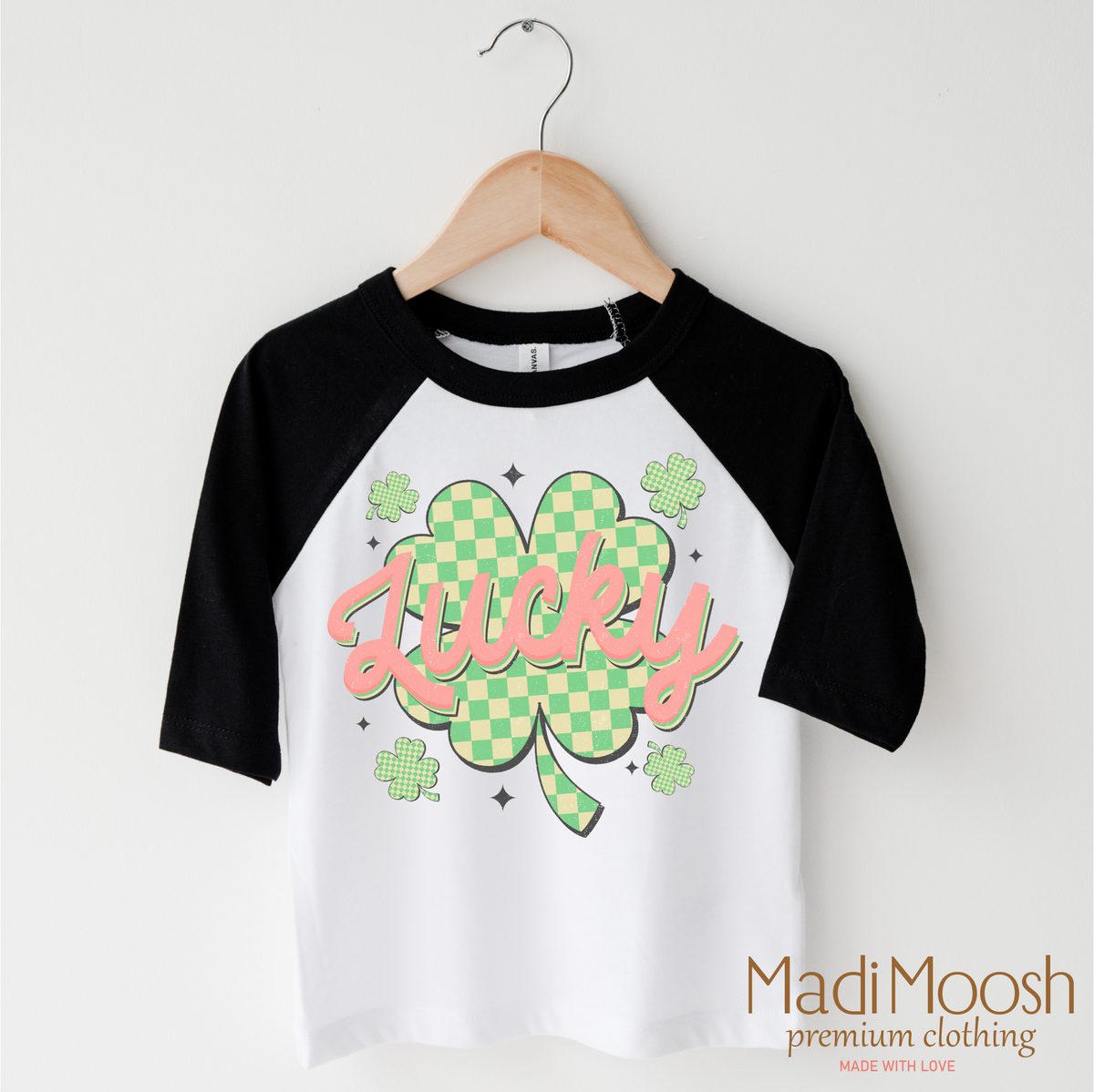 St. Patrick's Day Lucky Clover design on a black-accented shirt.