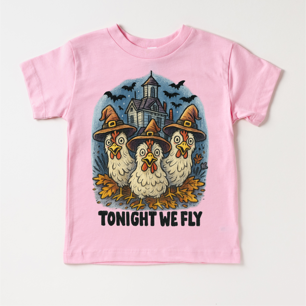 Tonight We Fly Chicken Witch Halloween design on a pink garment.