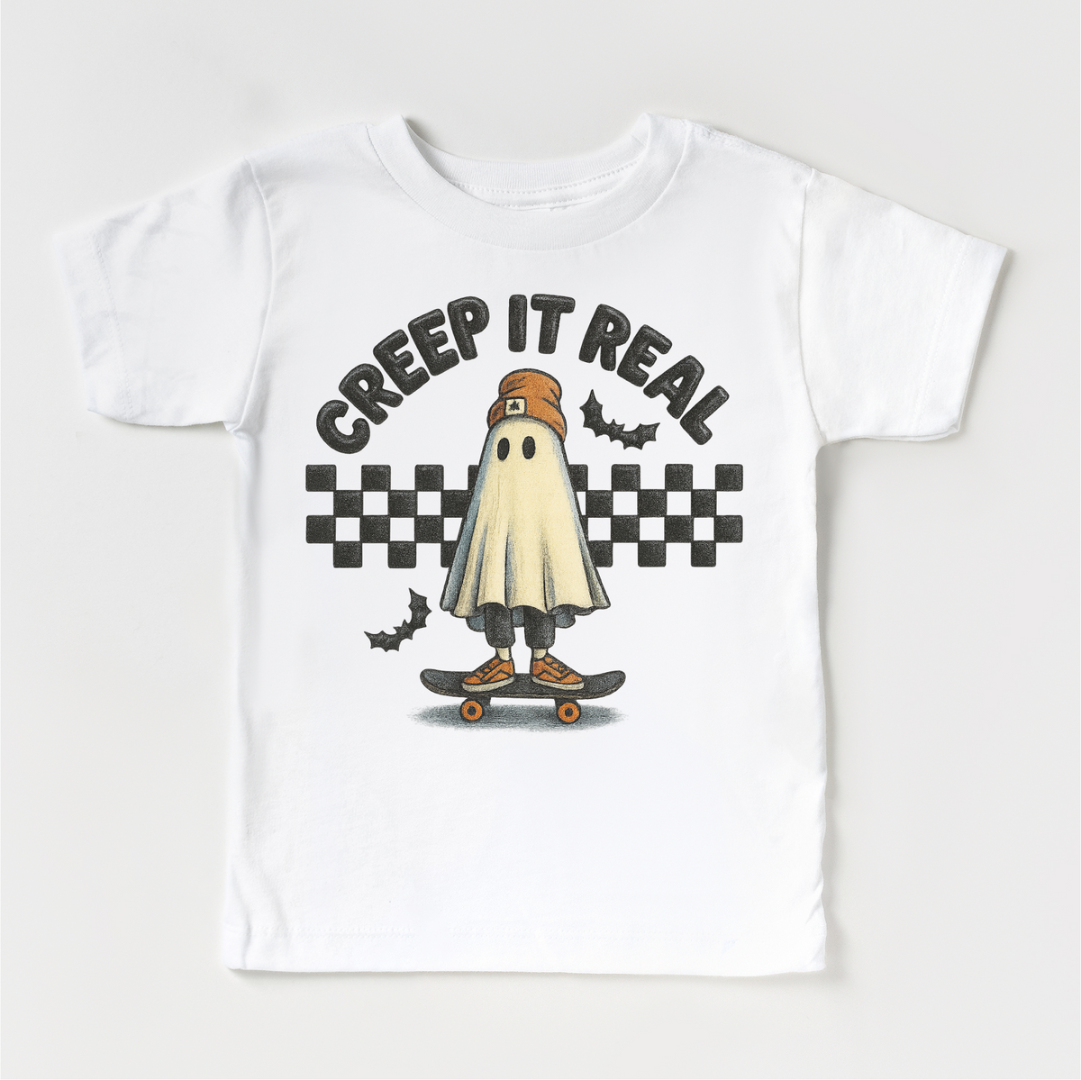 Retro Creep It Reel Skater Halloween design on a white garment.
