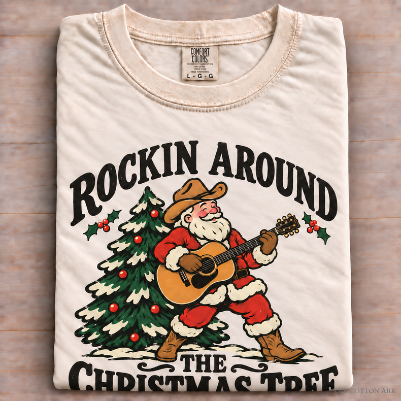 Natural Comfort Colors Rockin Around the Christmas Tree Shirt folded on wood