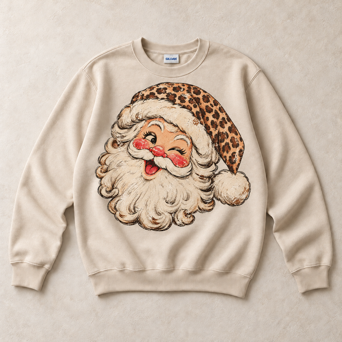 Sand Gildan crewneck sweatshirt with vintage winking leopard Santa graphic