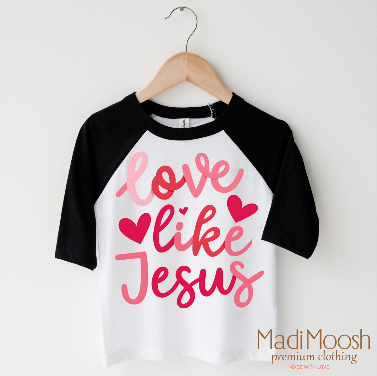 Love Like Jesus Valentine's Day design on a black-accented shirt.