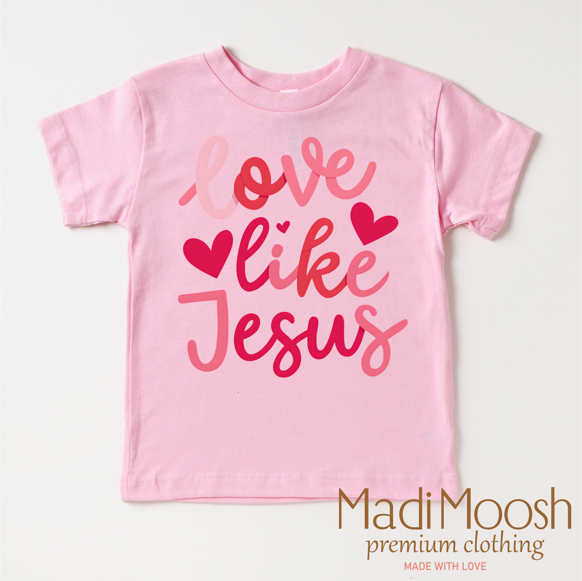 Love Like Jesus Valentine's Day design on a pink garment.