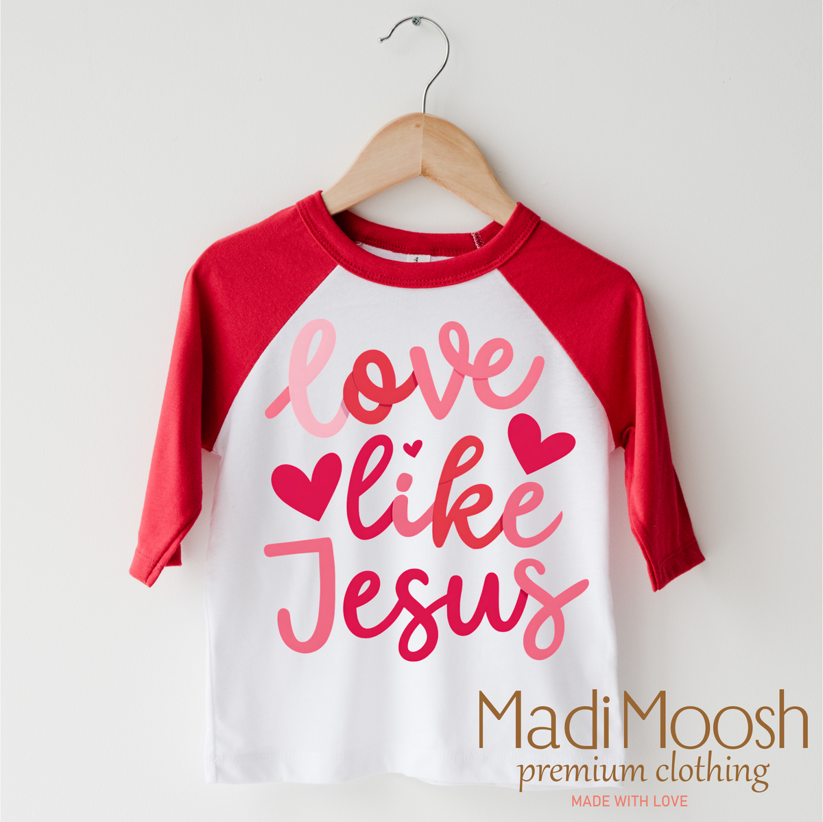 Love Like Jesus Valentine's Day design on a red-accented shirt.