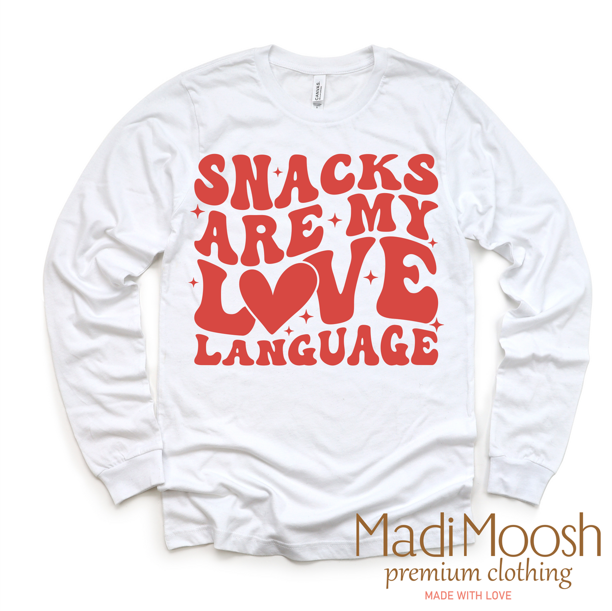 Snacks Are My Love Language Valentine's Day design on a long sleeve shirt.