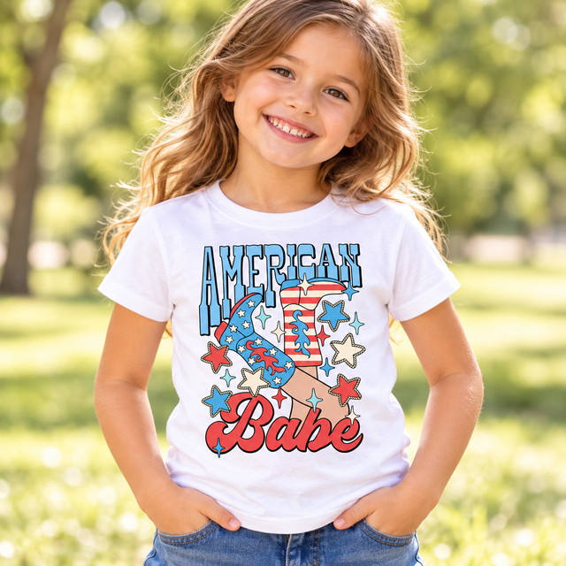 Child wearing a white American Babe Shirt outdoors
