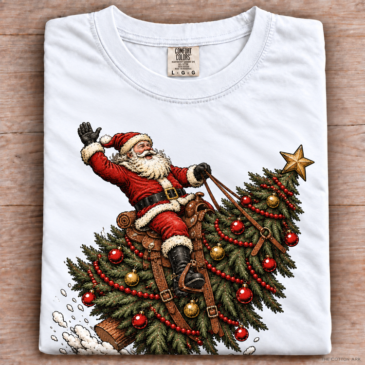 White folded Comfort Colors Santa Riding Christmas Tree Shirt