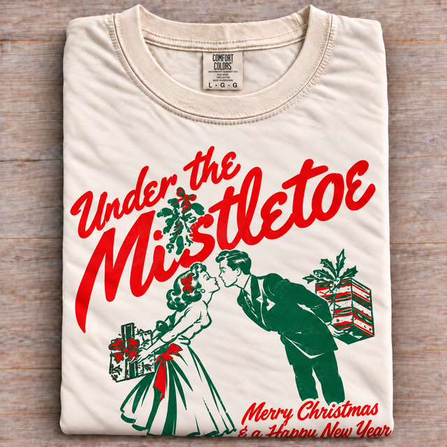 Under the Mistletoe Christmas tee, natural folded shirt