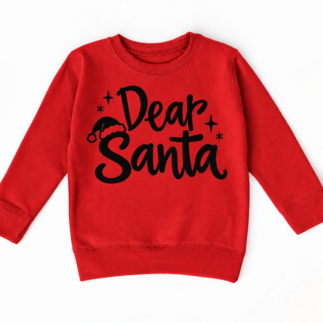 Dear Santa Christmas shirt features black script lettering, a Santa hat and stars. Shown on red sweatshirt, front view.