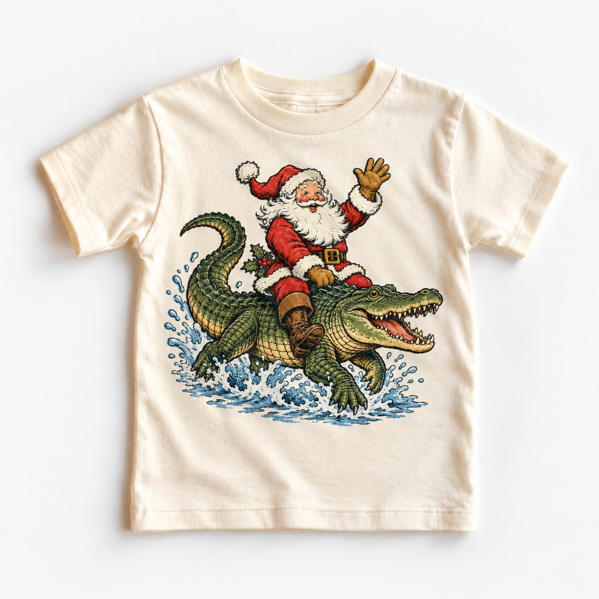 Vintage-style Santa riding a green alligator on a natural Madi Moosh Christmas tee