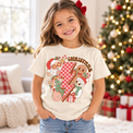 Child wearing natural Christmas Characters Shirt in a festive Christmas setting