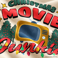 Illustrative close-up design preview of Christmas Movie Junkie Shirt on natural fabric