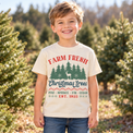 Child wearing natural Farm Fresh Christmas Trees Shirt in a festive Christmas setting