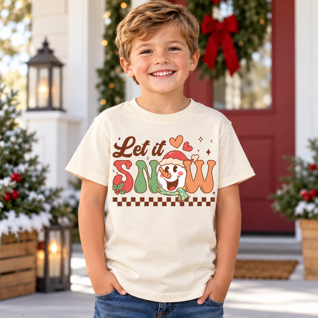 Child wearing natural Let It Snow Shirt in a festive Christmas setting
