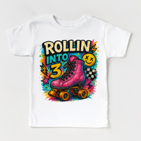 Rollin Into 3 Roller Skating Birthday design on a white garment.