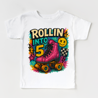 Rollin Into 5 Roller Skating Birthday design on a white garment.