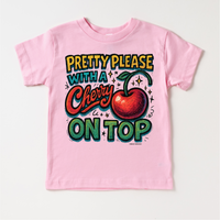 Pretty Please With A Cherry On Top design on a pink garment.