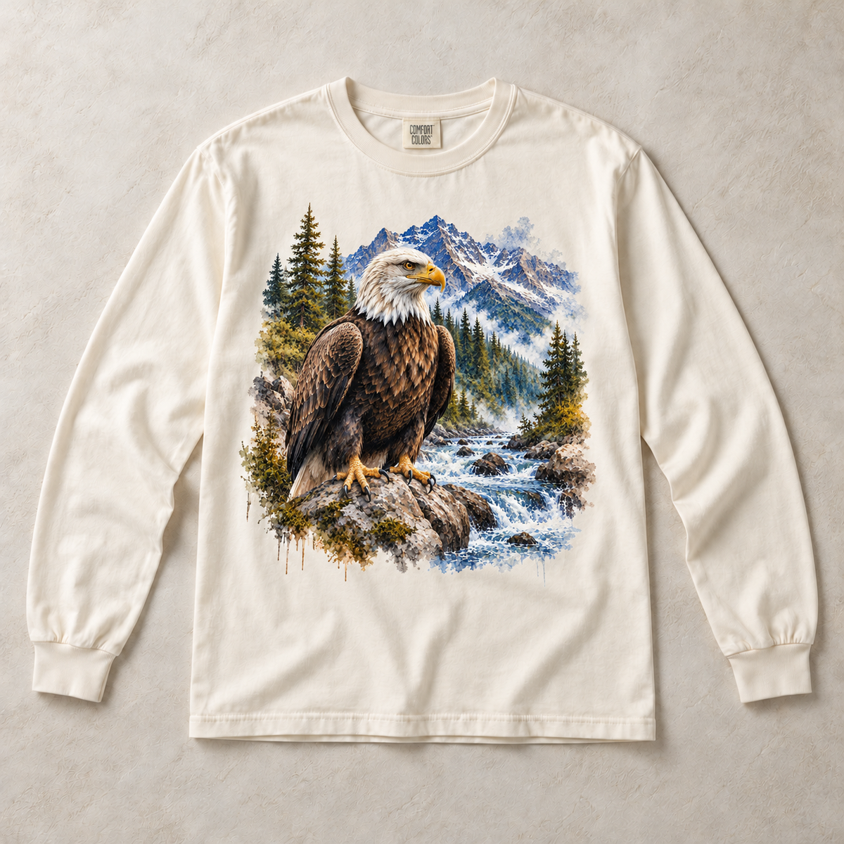 Ivory Comfort Colors long-sleeve T-shirt with Bald Eagle Mountain graphic, front flat lay